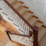 Straight scissor stair with box newels and wood balusters.