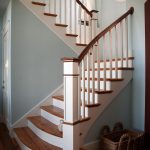 Straight scissor stair with box newels and wood balusters. Stair features reclaimed wood treads and sepele mahogany railing. Stair has a slight flair at its base.