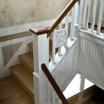 Straight stair with custom box newels and custom wood balusters.
