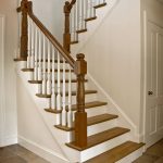Straight scissor stair with wood balusters and turned newels.