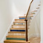 Curved staircase with tiled risers.