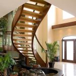 Unsupported curved staircase with open risers.