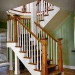 Straight scissor stair with box newels and wood balusters.