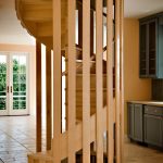 Wood spiral staircase with a unique balustrade.