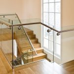 Modern scissor stair with glass railing.