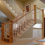 Scissor stair with box newels and wood balusters. The upper stair is unsupported.