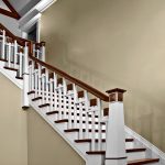 Unique straight stair with custom balusters and a custom newel post.