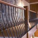 Guardrail with wrought iron balusters.