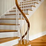 Winding staircase with a unique custom curved rail.