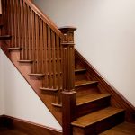 Straight stair with a box newel and wood balusters.