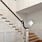L-shaped stair with box newels and wood balusters. Stair features wood balusters.