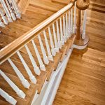 Over-the-post stair with wood balusters.