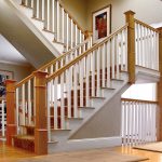 Unsupported straight stair with box newels and wood balusters.