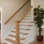 Straight stair with box newels and wood balusters.