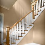 L-shaped straight stair with box newels and wood balusters.