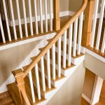 L-shaped straight stair with box newels and wood balusters.