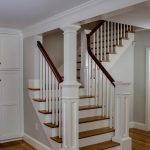 Straight stair with box newels and wood balusters.