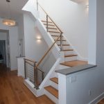 Stair with cable railing in a modern home.