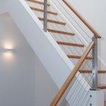Stair with cable railing in a modern home.