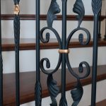 Close-up photo of a wrought iron baluster.