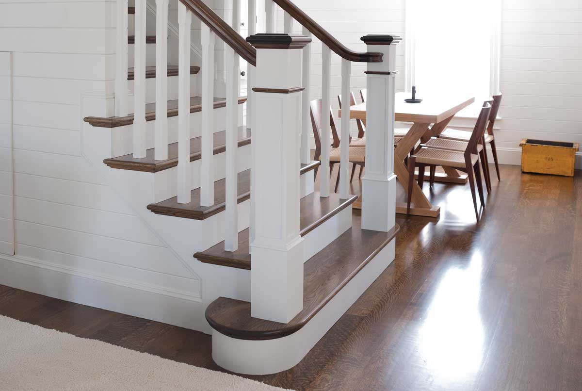 photo of stair with box newels and dark treads